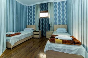 Фото номера Двухместный номер с 2 отдельными кроватями Отель HOTEL GUGLUX &amp;WINE CELLAR г. Телави 4